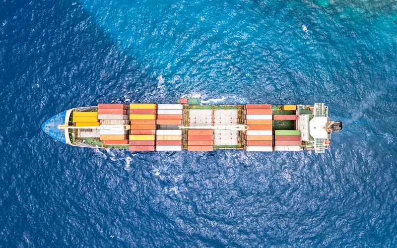 Aerial view of container cargo ship crossing the ocean